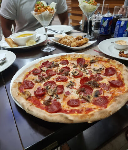 Pizzaro ristorante italiano - Sharjah - +971 600 520000